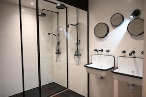 Family Suite, Garden View | Bathroom | Hair dryer, towels, soap, shampoo