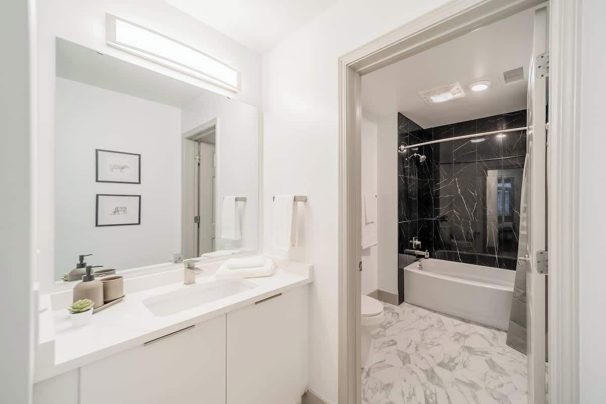 Shower, hair dryer, towels, shampoo