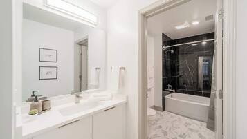 Shower, hair dryer, towels, shampoo
