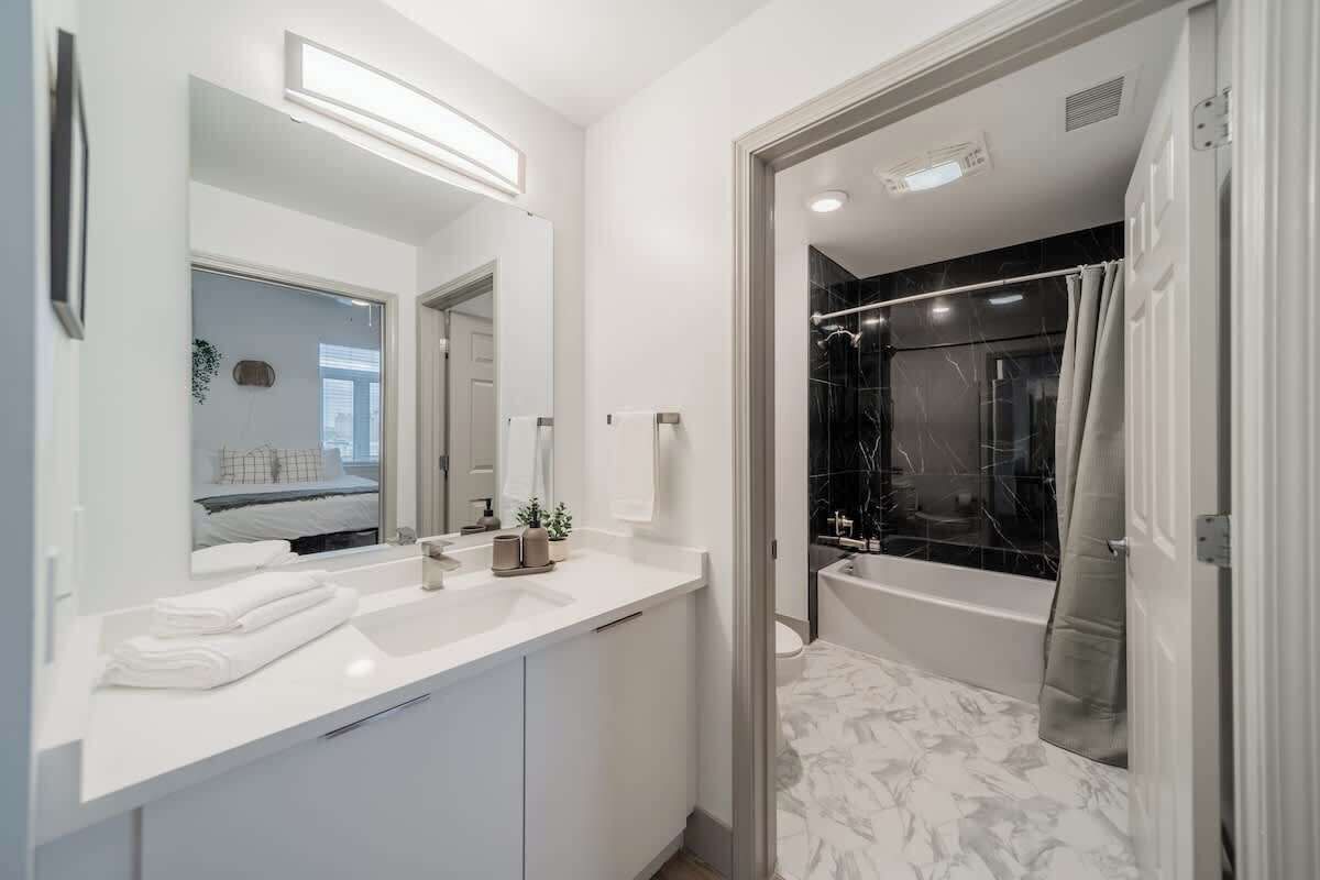 Shower, hair dryer, towels, shampoo