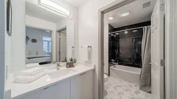 Shower, hair dryer, towels, shampoo