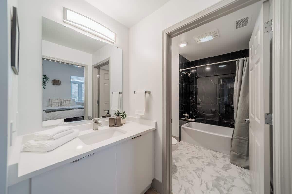 Shower, hair dryer, towels, shampoo