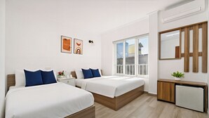 A modern hotel room with two beds, a small desk, a mirror, and a window. - Hanoi Miah 205 Hang Bong Hotel (Hanoi)
