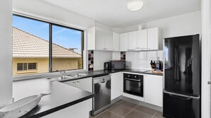 Fridge, microwave, oven, stovetop - Caribbean Unit 4, 12 Mahia Tce, Kings Beach (Kings Beach)