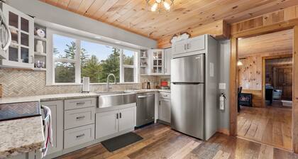4 BR modern farmhouse with 173 ft of private lakefront on tranquil Loon Lake.