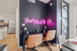 A modern kitchen with white cabinets and a black countertop. - 2 BR|2 Baths| Heart of D/T, near AAC & Aquarium (Dallas)