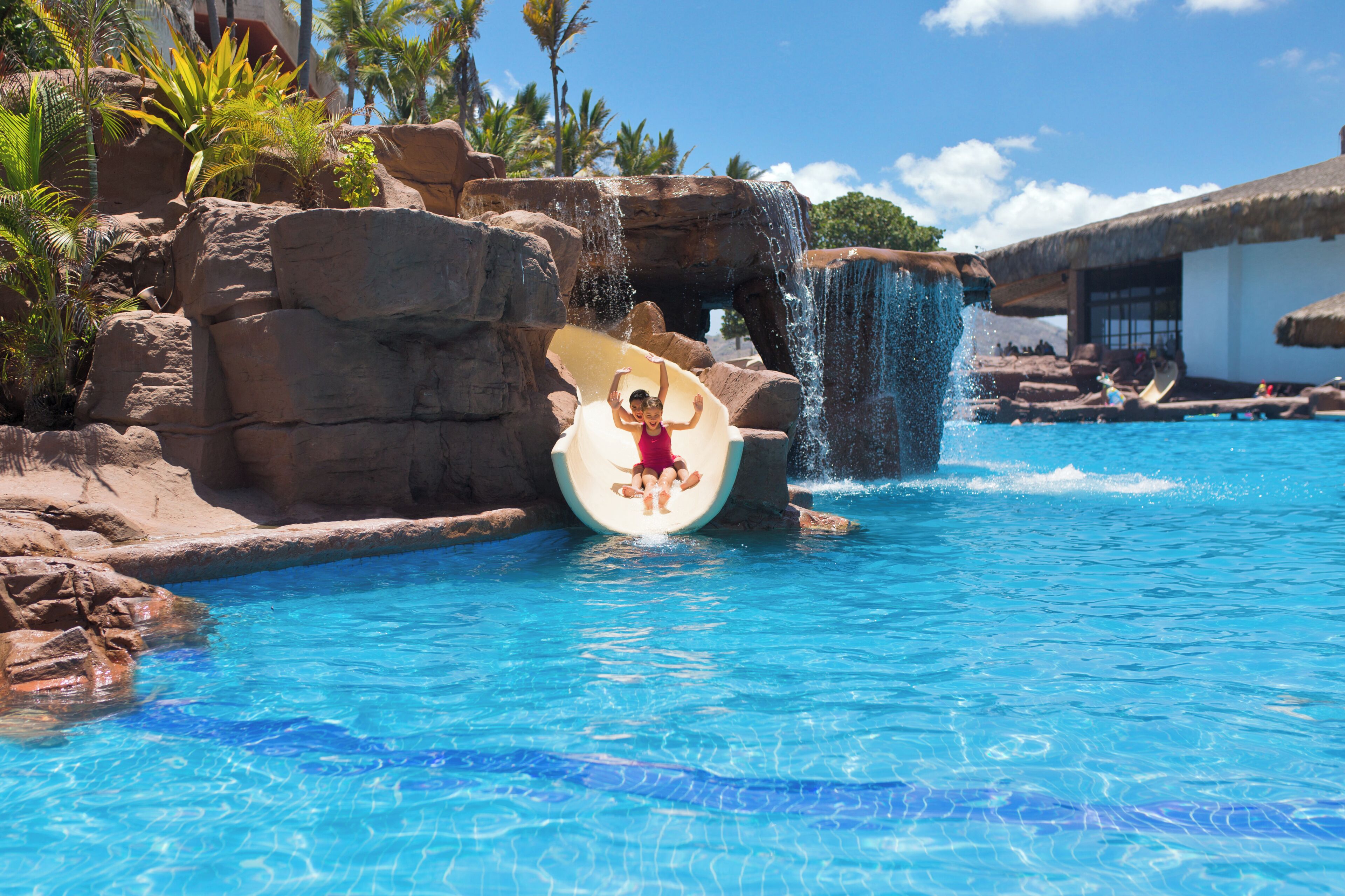 Outdoor pool, open 10:00 AM to 8:00 PM, pool umbrellas