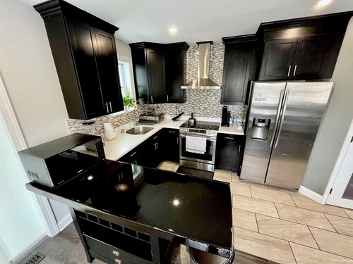 4BR Home with Free Parking + Outdoor Fenced Patio