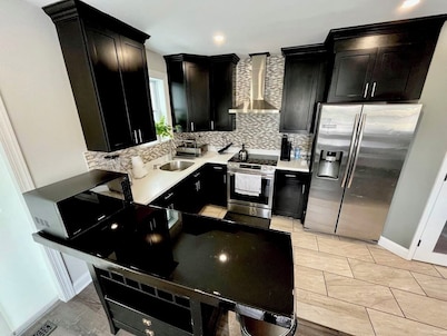 4BR Home with Free Parking + Outdoor Fenced Patio