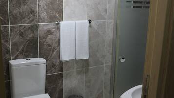 Shower, free toiletries, hair dryer, slippers