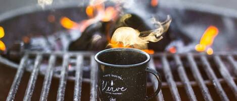 A black mug with the text "Verve Coffee Roasters" on a grill.
