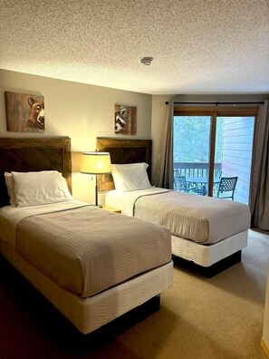 Condo, Multiple Beds, Fireplace, Garden View (Pointe Unit 202) | 2 bedrooms, individually decorated, individually furnished - The Pointe Resort & Club 2 Bedroom Condo (Minocqua)