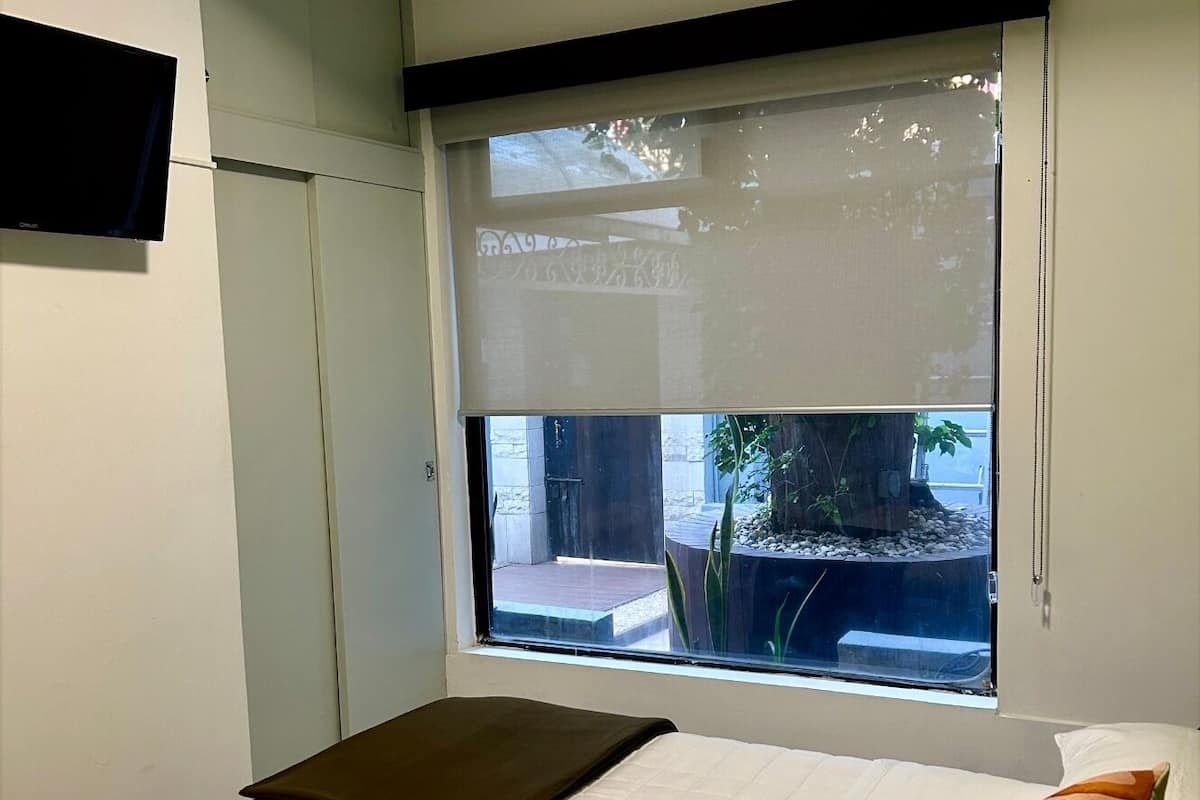 Habitación de lujo, vista al jardín | Cortinas blackout y wifi gratis