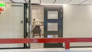 A hotel room entrance with a door leading to a kitchenette area. - Amazing apartment in Bjorli with WiFi (Bjorli)