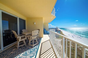 Outdoor dining - Coastal Calm Boardwalk 1601 • Remodeled 3BR Gulf-Front End Unit w/ Huge Balcony (Panama City Beach)