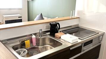 Leilighet – deluxe, balkong, fjellutsikt | Eget kjøkken | Kjøleskap, mikrobølgeovn, ovn og kokeplater