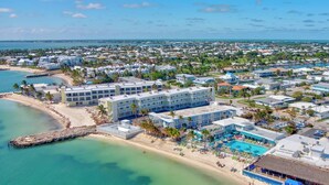 A resort with multiple buildings, a beach, and a pool area. - Waterfront Escape, Private Dock, Cabana Club, Keys Paradise (Key Colony Beach)