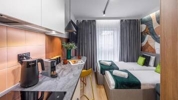 Suite studio, 2 lits jumeaux, non-fumeur, climatisation | Décor unique, fer et planche à repasser, accès au Wi-Fi (inclus)