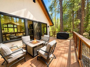A deck with outdoor furniture, a fire pit, and a grill. - Paradise on Pioneer - Pool Table + Fire Pit + Luxury (South Lake Tahoe)