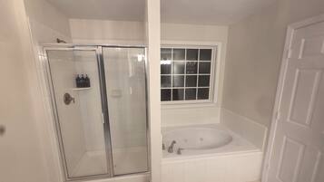 Shower, jetted bath, hair dryer, towels