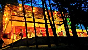 A multi-story building with a balcony and a staircase leading to the entrance. - Rudraksh Resort (Mussoorie)