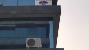 A hotel sign on a building with a modern design, indicating it is the Hotel Jasraj on the 3rd floor. - HOTEL JASRAJ (Ahmedabad)