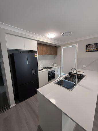 Fridge, microwave, oven, stovetop. Bright family-friendly home with garden