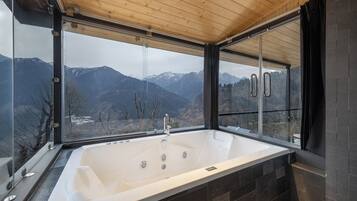 Separate bathtub and shower, free toiletries, slippers, towels