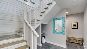 A staircase with white railings and wooden steps leading to a landing. - Easy Beach Access! Port A Oasis w/ Private Pool (Port Aransas)