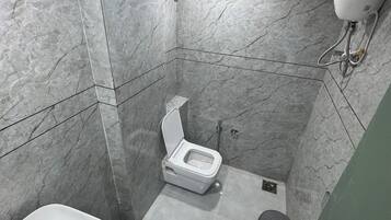 Deluxe Double Room, City View | Bathroom | Free toiletries, slippers, towels, soap