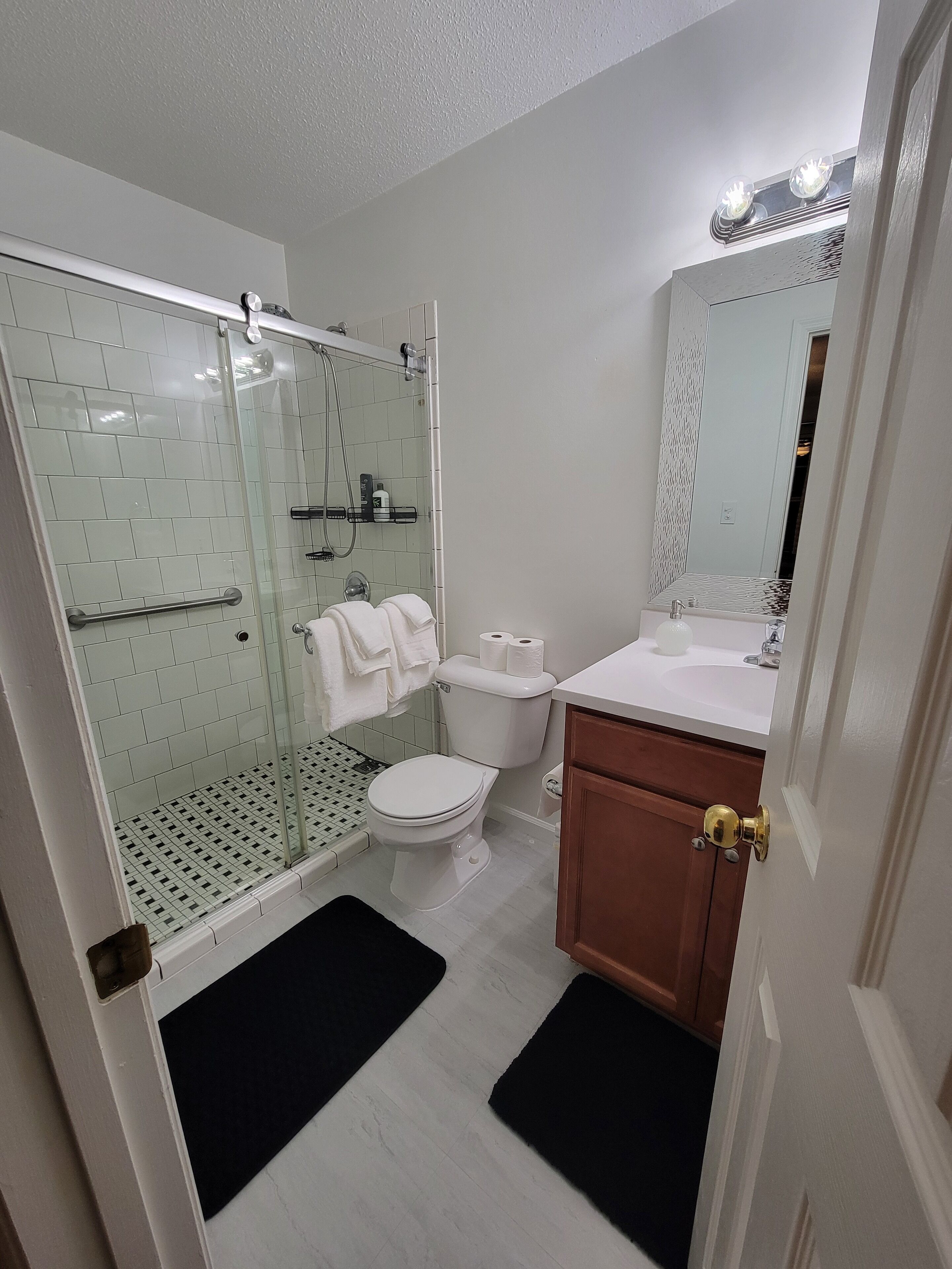 Shower, hair dryer, towels, soap