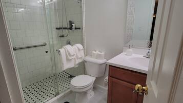 Shower, hair dryer, towels, soap