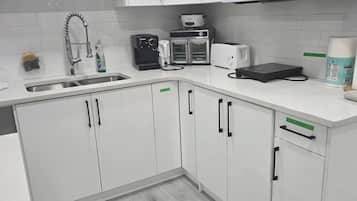 Fridge, microwave, stovetop, coffee/tea maker