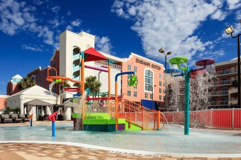 Cool off under fountains while kids laugh and explore.