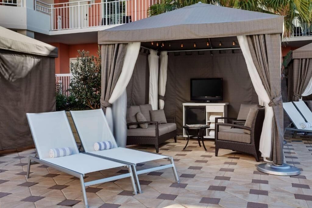 Lounge in a private cabana and savor poolside calm.