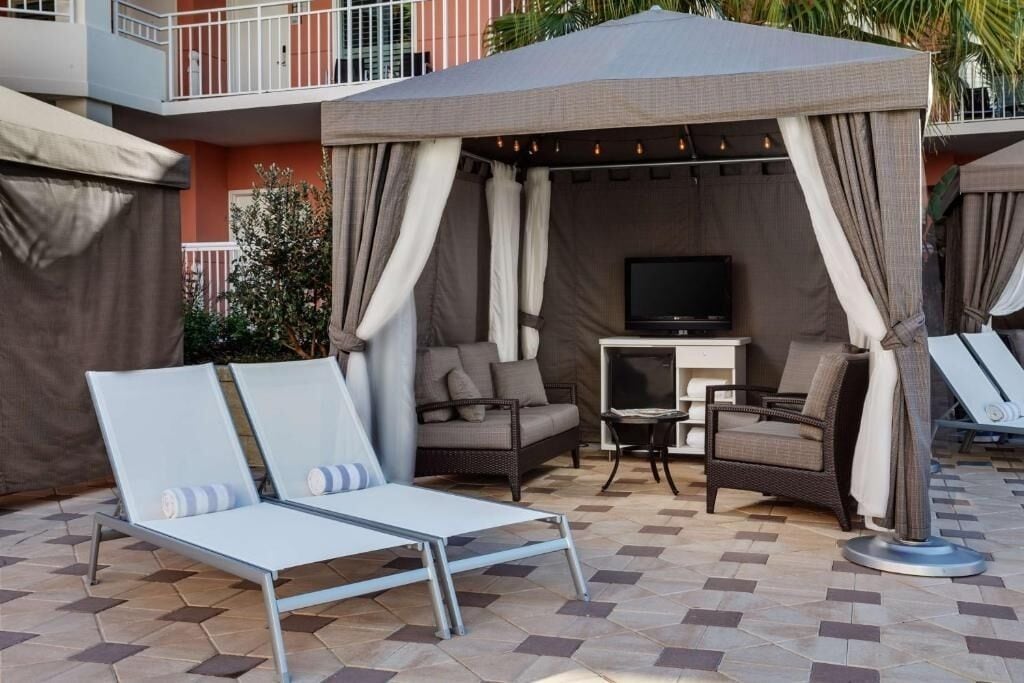 Lounge in a private cabana and savor poolside calm.
