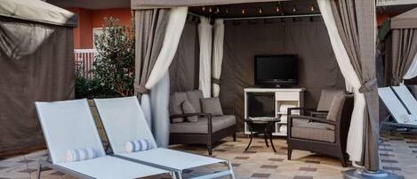 Lounge in a private cabana and savor poolside calm.