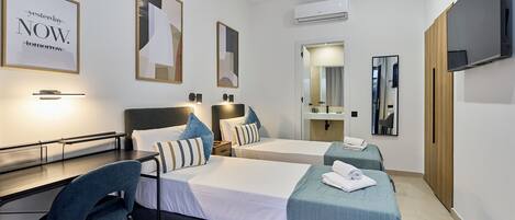 Twin Room | Premium bedding, down comforters, desk, laptop workspace