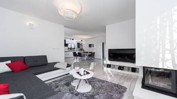 Luxury Villa, Partial Sea View | Living area | 100-cm LCD TV with satellite channels, fireplace