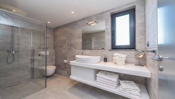 Luxury Villa, Partial Sea View | Bathroom | Shower, hair dryer, towels
