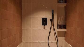 Hydromassage showerhead, designer toiletries, hair dryer, bathrobes