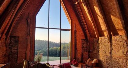 Wooden house in the heart of nature