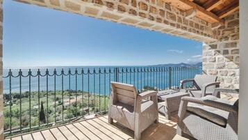 Junior Triple Room, Multiple Beds, Private Bathroom, Beach View | Terrace/patio