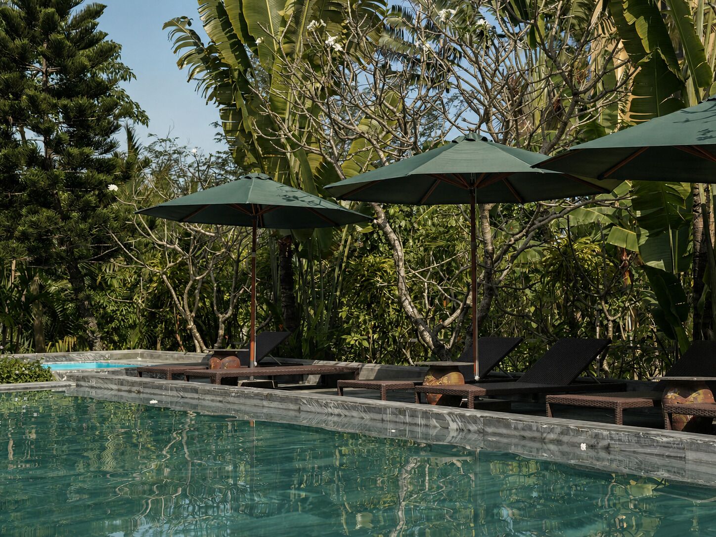 2 outdoor pools, open 6:00 AM to 7:00 PM, pool umbrellas, pool loungers