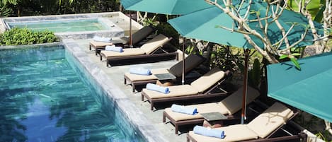 2 outdoor pools, open 6:00 AM to 7:00 PM, pool umbrellas, pool loungers