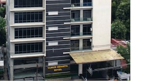 A modern hotel building with multiple floors, large windows, and a flat roof. - Yankin Heights Hotel (Yangon)