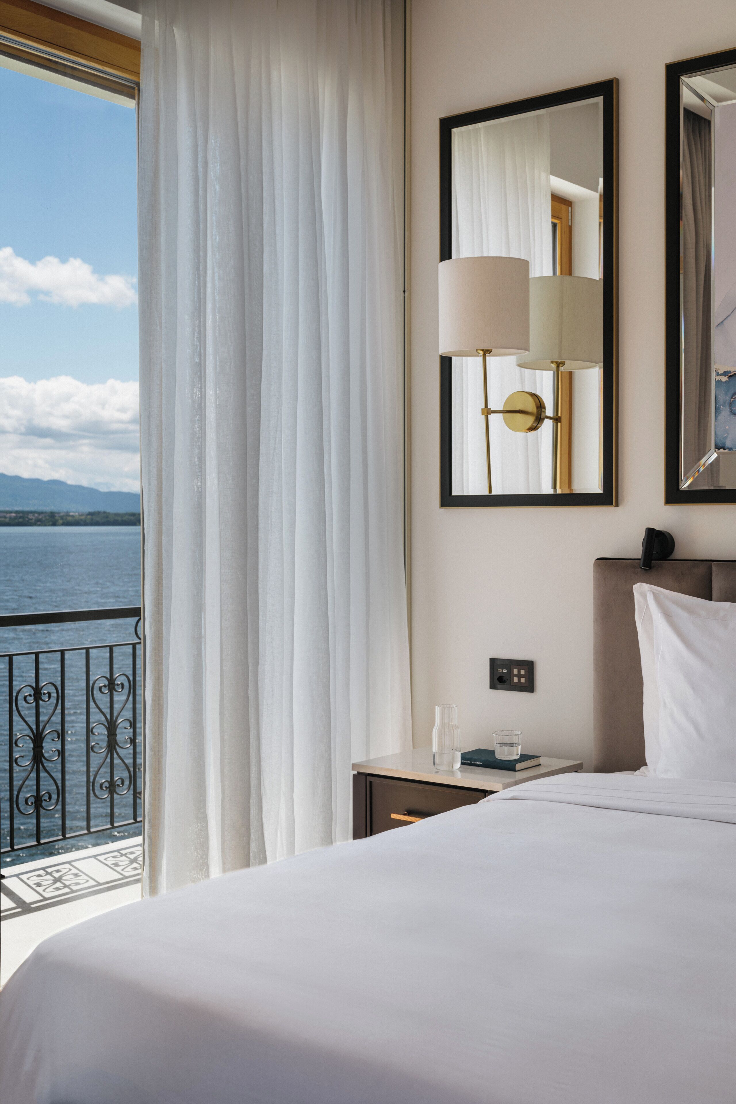 Luxury Suite, Balcony, Lake View | Minibar (some free items), in-room safe, desk, blackout drapes