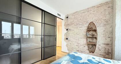 Location: Prime location, just steps from the sea, the Rotonda a Mare, and the historic center.Description: Located on the first floor, this new three-room apartment is furnished in an industrial style. The interior spaces are enhanced by exposed brick w