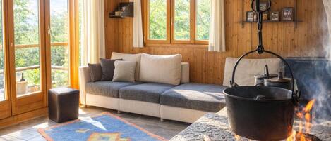 Family Chalet, Multiple Bedrooms, Mountainside (Ca Brunella 2) | Living area | 21-inch TV with digital channels, fireplace