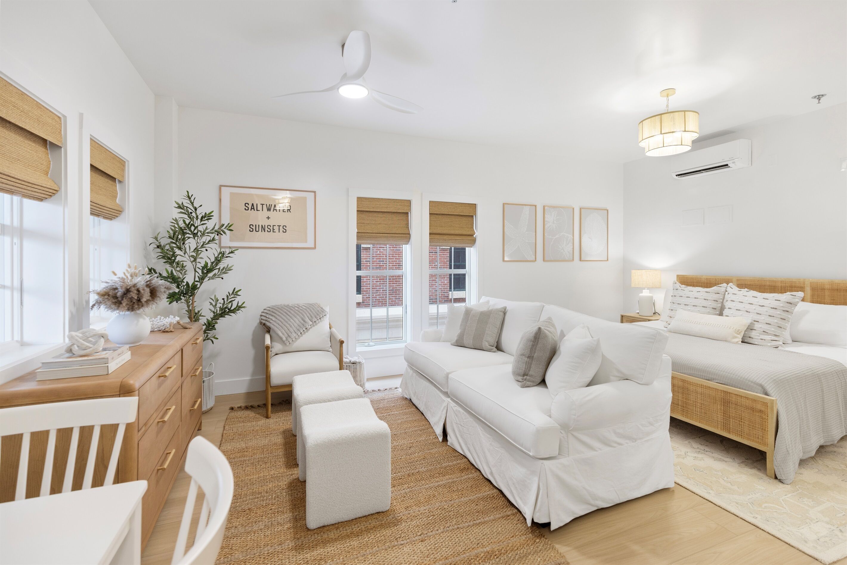 Relax in your serene coastal-inspired suite where natural textures and warm wood tones create the perfect retreat for rest and relaxation.